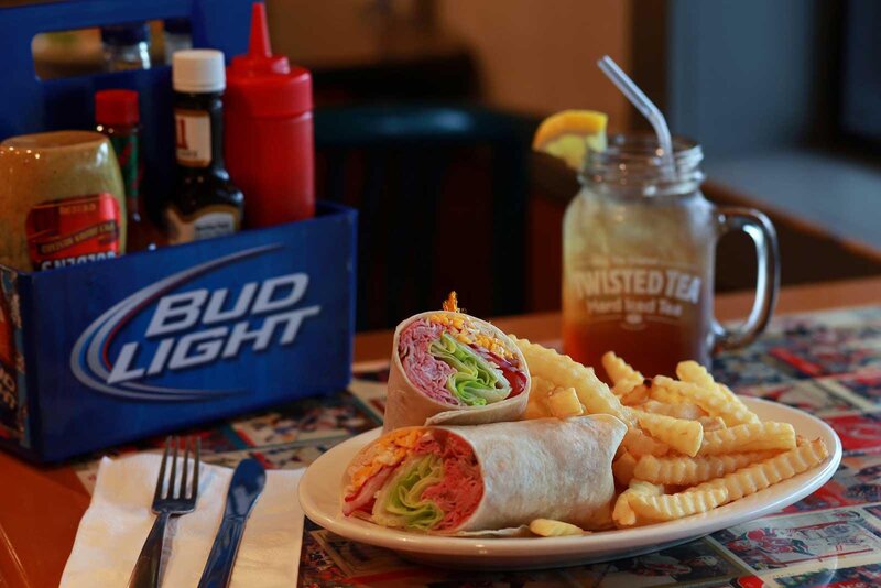 Wrap sandwich with french fries and ice tea